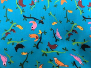 blue background small multi coloured birds fabric