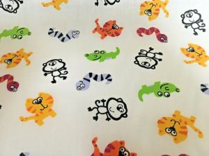 multi coloured cats snakes monkeys fabric online