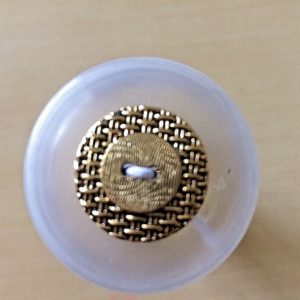 round gold button