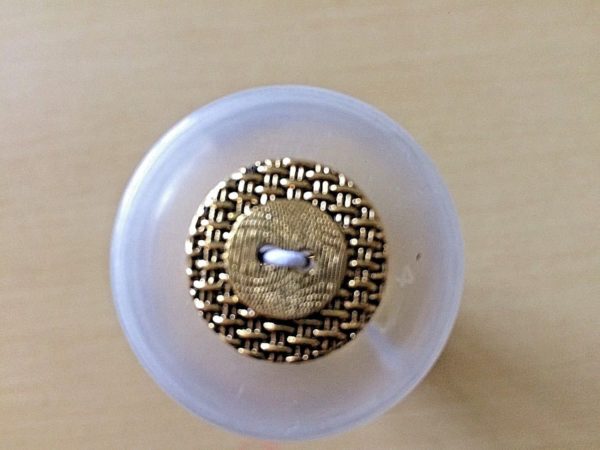 round gold button