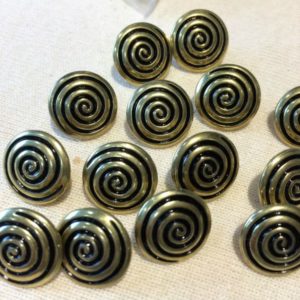 gold and black circle swirl buttons