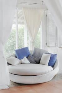Curtains and accessories - white curtains and chair with blue cushions